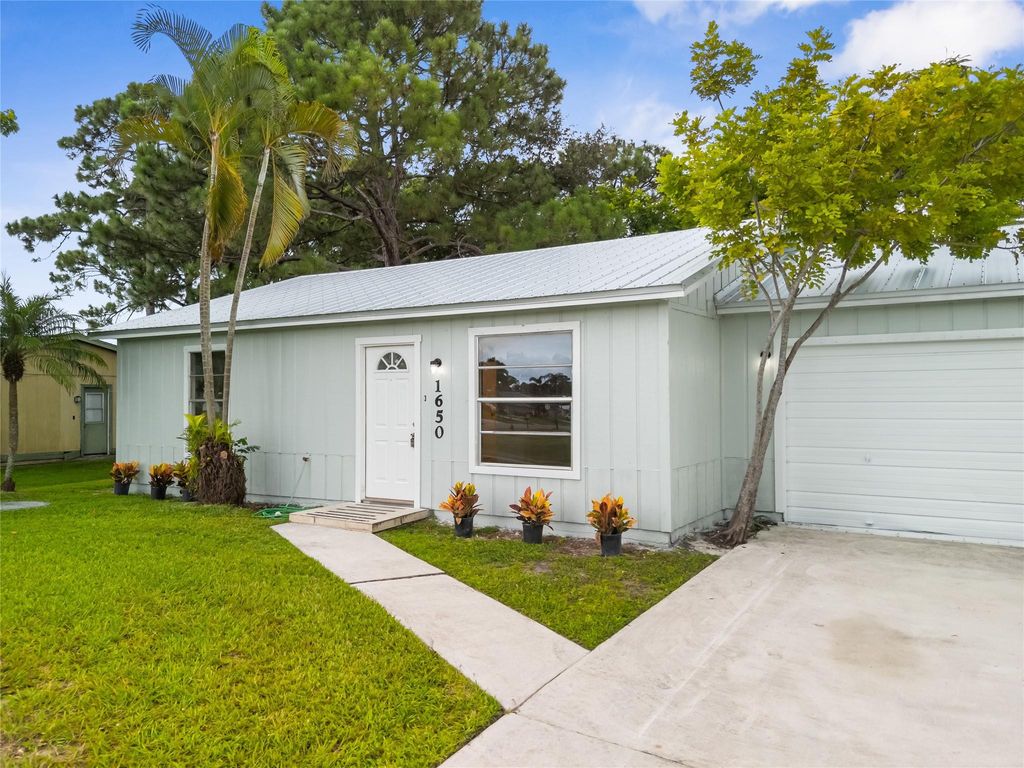 Photo of 1650 SE Ocean Lane, Port Saint Lucie, FL 34983 (MLS # F10522849)