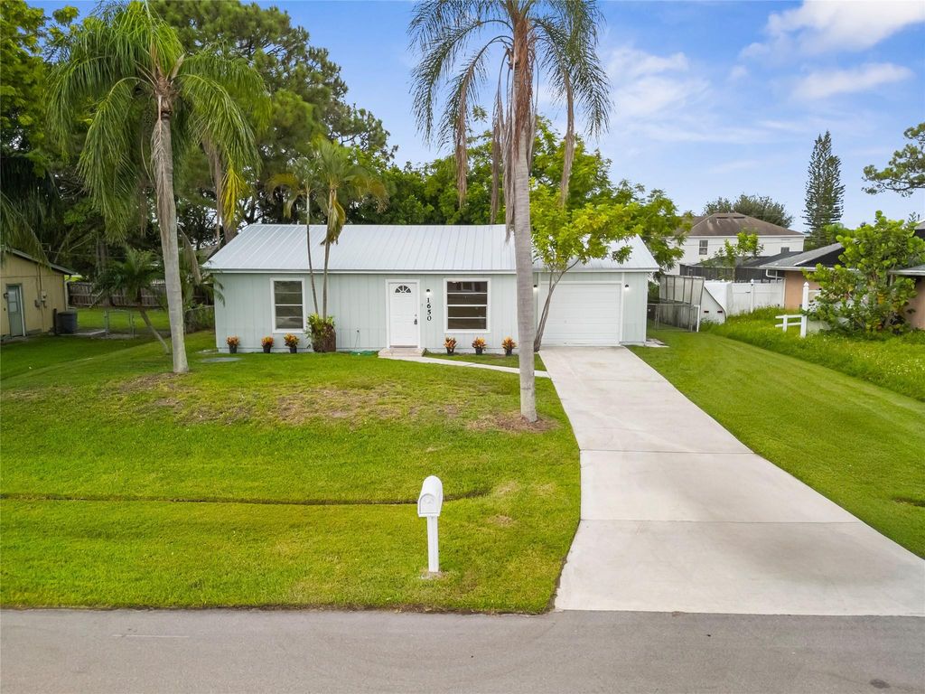 Photo of 1650 SE Ocean Lane, Port Saint Lucie, FL 34983 (MLS # F10522849)