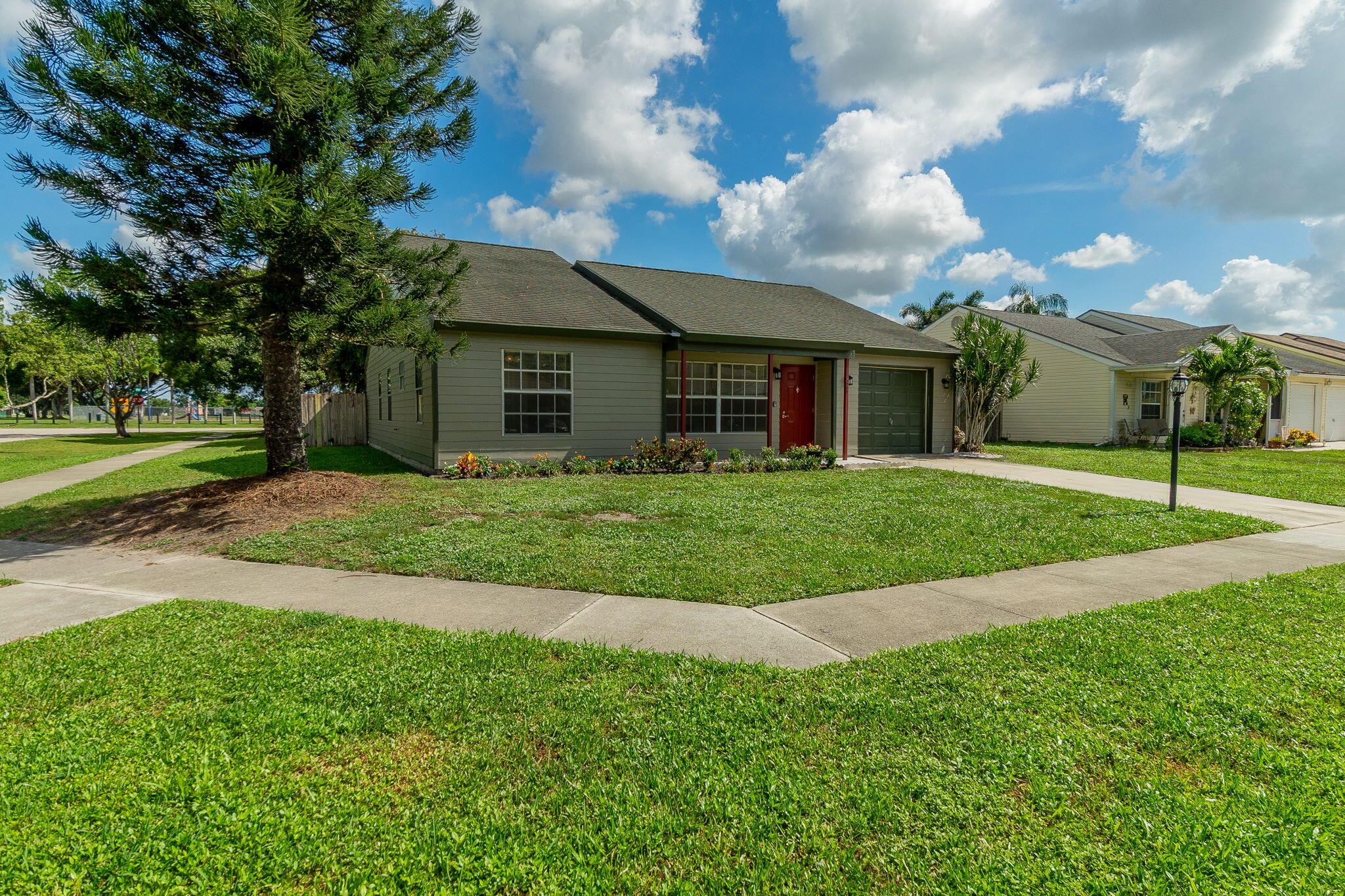Welcome to this beautifully maintained 3 bedroom, 2 bathroom home with a one-car garage, nestled in a peaceful residential community in Greenacres, Florida. Featuring a spacious open layout and abundant natural light, this home is perfect for comfortable living and entertaining.Enjoy a large fenced private backyard pet friendly ideal for relaxing, gardening, or hosting gatherings. The community offers an extremely low monthly HOA fee, providing excellent value while maintaining the neighborhood's appeal.Located just steps away from a lovely park and minutes from shopping, dining, and major roadways, this property combines convenience with a quiet suburban lifestyle.Don't miss your chance to own this gem in a highly desirable location! Brand new AC !