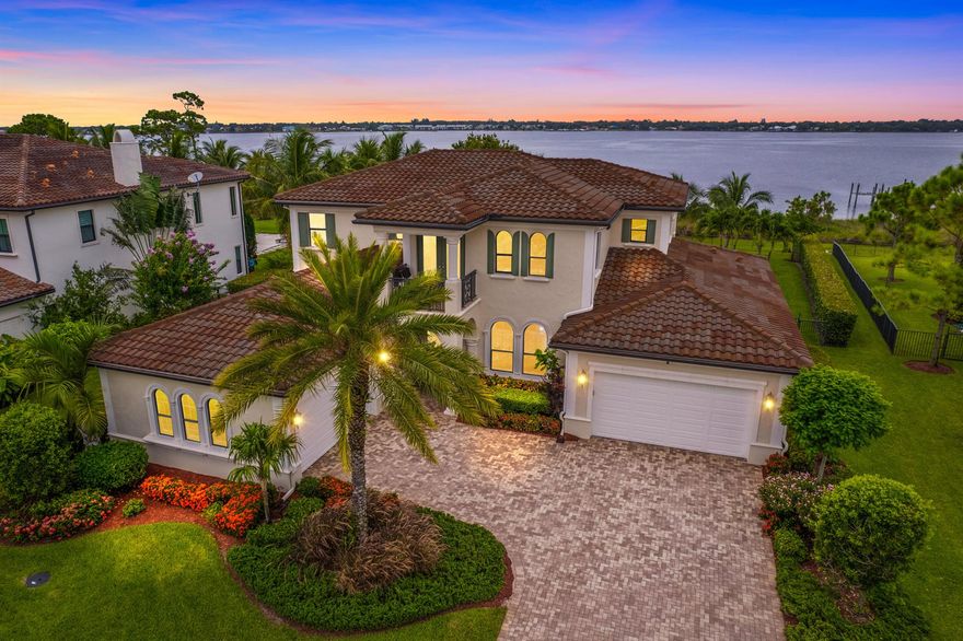 Stunning Views! Wide waterfront estate, no fixed bridges with expansive backyard in Riverbend, a gated boutique community of 47 homesites.Martin County A rated schools! Keep your boat on the lift at your private 150ft dock and cruise to the ocean for day fishing,This rare gem built in 2016, concrete block construction, features 5460 total sq ft, 5 bedrooms plus large bonus loft  and 5 bathrooms w/2 split garages for four cars.The primary bedroom suite and secondary bedrooms are on the ground floor.All impact windows and doors and concrete block construction.The kitchen boasts quartzite countertops, island, subzero refrigerator and wolf appliances including double ovens.The fenced back yard includes a 43-foot heated,salt water pool w/spa, and whole house generator.