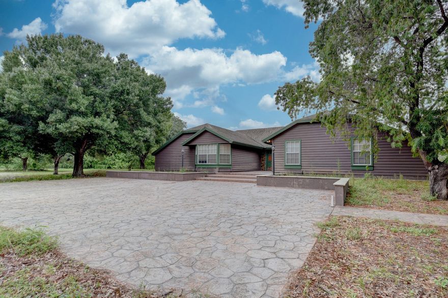 Set on a 6.19 acre corner lot within the gated Wildwood community 19153 Eagles Way Court offers a rare blend of equestrian functionality, natural beauty, and peaceful country living. Surrounded by mature trees and tranquil  pond, this unique property creates a private park-like setting ideal for horse lovers and outdoor enthusiasts alike.  The property features a 4 bedrooms, 2 baths along with 14-stall barn designed for equestrian use, training, or boarding potential. Located near White Fences Equestrian Estates - Palm Beach Dressage. Property is located in one of Palm Beach County's emerging acreage and equestrian corridors. Conveniently located  near Lion Country Safari, Westlake, Arden, the future Silver Lake and Village Landing development, access to Wellington International and  approx 30 minutes to Palm Beach.  This property offers exceptional versatility for full-time living, seasonal enjoyment, equestrian operations, or long-term investment potential.  Additional opportunity available with two neighboring properties also being offered for sale at 4935 Lame Panther Lane and an adjoining 4.28-acre parcel within Wildwood — creating exceptional potential for a larger family compound, equestrian facility, or investment assemblage.
