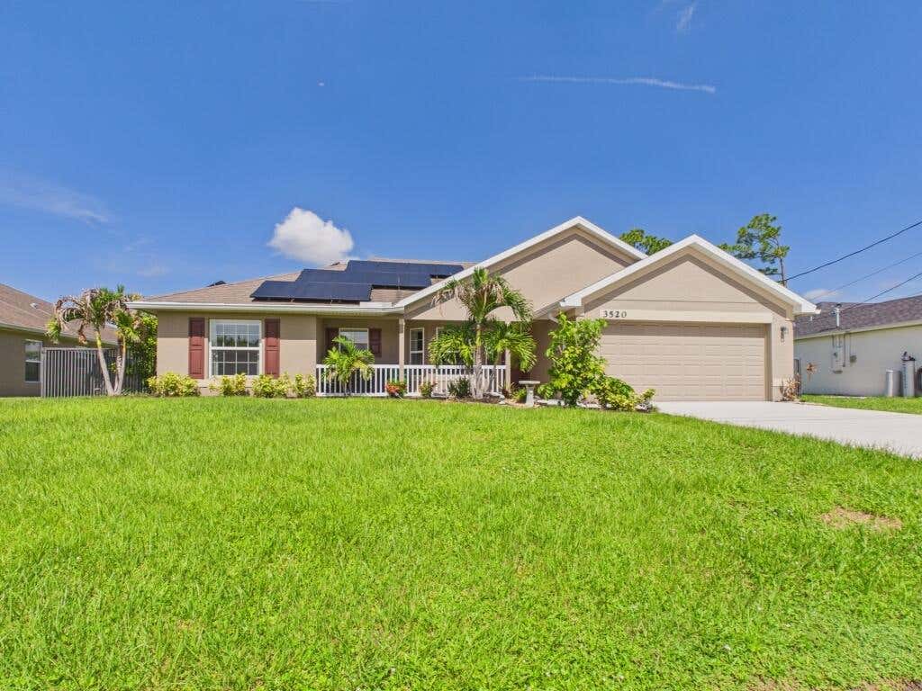 Photo of 3520 SW Masilunas Street, Port Saint Lucie, FL 34953 (MLS # B26050448)
