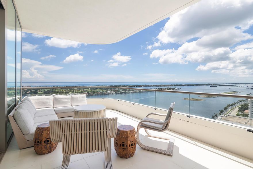 Experience luxury waterfront living in this stunning 3 bedroom, 3.5 bath residence at La Clara, showcasing breathtaking panoramic views of the Atlantic ocean and Palm Beach Island. Enter through the foyer into an open-concept living and dining area, framed by floor-to-ceiling windows and soaring ceilings. A well-appointed kitchen follows, featuring an oversized island, 6-burner gas cooktop, and Miele appliances.  Just off the main living space, an expansive covered terrace with southeast exposure provides incredible unobstructed water views. The primary suite serves as a private sanctuary, complete with its own covered terrace, dual walk-in closets, and a luxurious bath offering a separate shower, Roman tub, and private water closet.