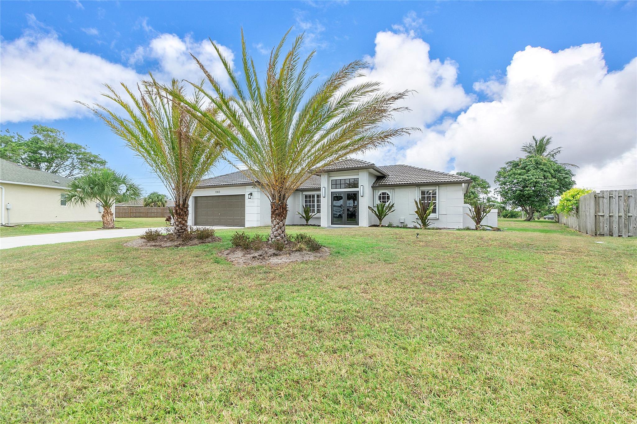 This beautifully renovated home with its sheer beauty & simplicity is being offered for rent annually. This home is cozy & warm while still being light filled with an open floor plan that flows seamlessly from the entry way to the living/dining area & into the kitchen. The Chef style kitchen is equipped with everything you need & boast an oversized island that's perfect when entertaining. The bedrooms are very spacious and consist of very large closets. The garage house 2 cars & also includes laundry utility. There's an enclosed patio that's relaxing and tranquil. This home is also nestled on an oversized lot that's perfect for boats & Rv's. Located in close proximity to the preserves, nature parks & the beach. This is a must see!