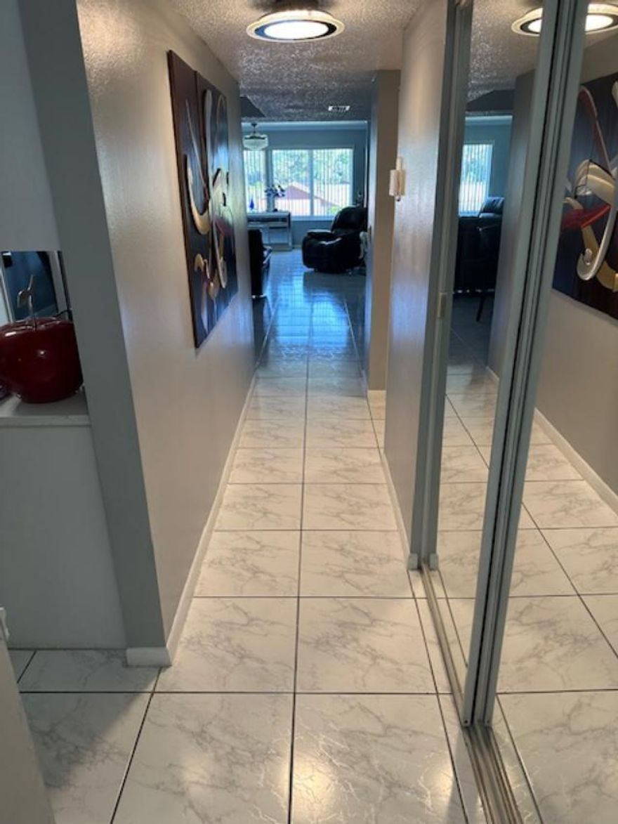 ABSOLUTELY GORGEOUS TWO BEDROOM TWO BATH CONDO IN MOVE IN CONDITION. BEAUTIFULLY UPDATED. DOUBLE DOOR ENTRY. EXTRA LONG KITCHEN AND BREAKFAST AREA. PLENTY OF CABINETS. STAINLESS STEEL APPLIANCES. EXTENDED DINING, LIVING AND SITTING AREA, OVERLOOKING THE POOL AND GOLF COURSE. TITLE AND WOOD LAMINATE FLOORS. CROWN MOLDING. PRIMARY BATH HAS DUAL SINKS AND WALK IN SHOWER.  LARGE WALK IN CLOSET AND PLENTY  OF ADDITIONAL CLOSET SPACE. WASHER DRYER IN THE UNIT. THE ENTIRE CONDO HAS PLENTY OF NATURAL LIGHT AND A NICE OPEN FEELING. ELEVATOR IN THE BUILDING. ASSOCIATION HAS, POOL, CLASSES, ENTERTAINMENT AND MORE. CONVENIENTLY LOCATED WITHIN MINUTES OF THE OF THE TURNPIKE, SHOPPING, RESTAURANTS. SHORT DRIVE TO THE BEACH