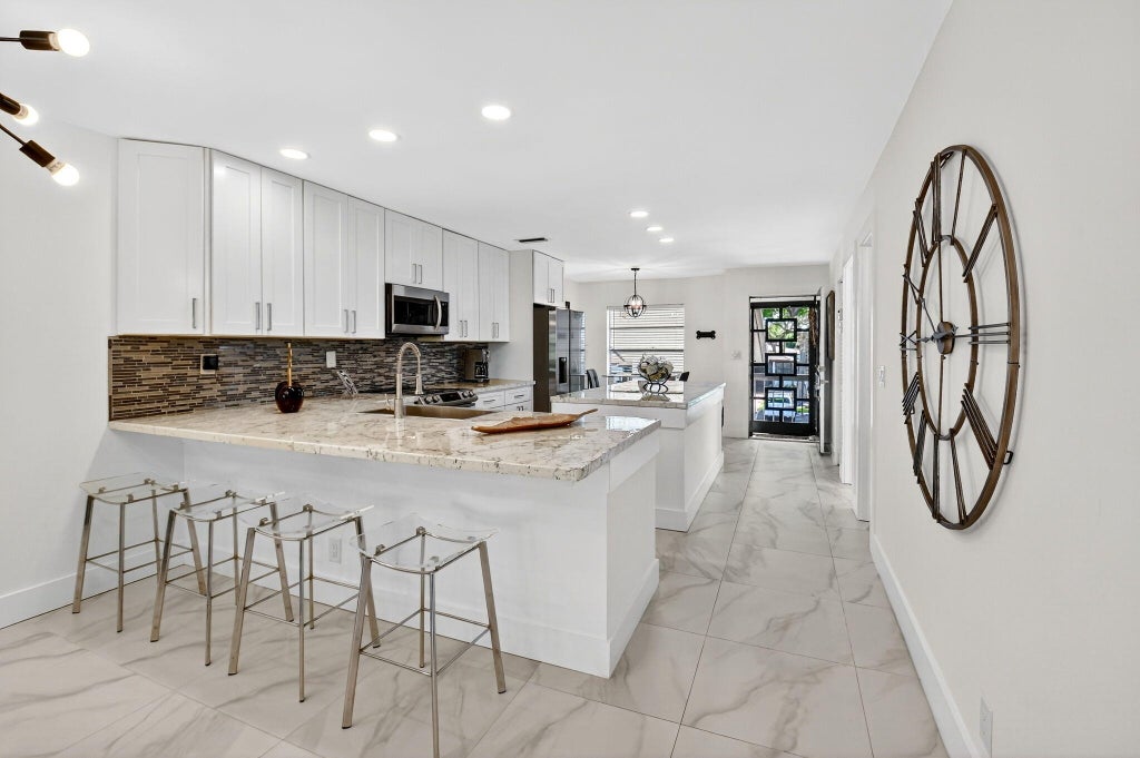 Photo of 13213 LUCINDA PALM Court #D, Delray Beach, FL 33484 (MLS # B26089700)