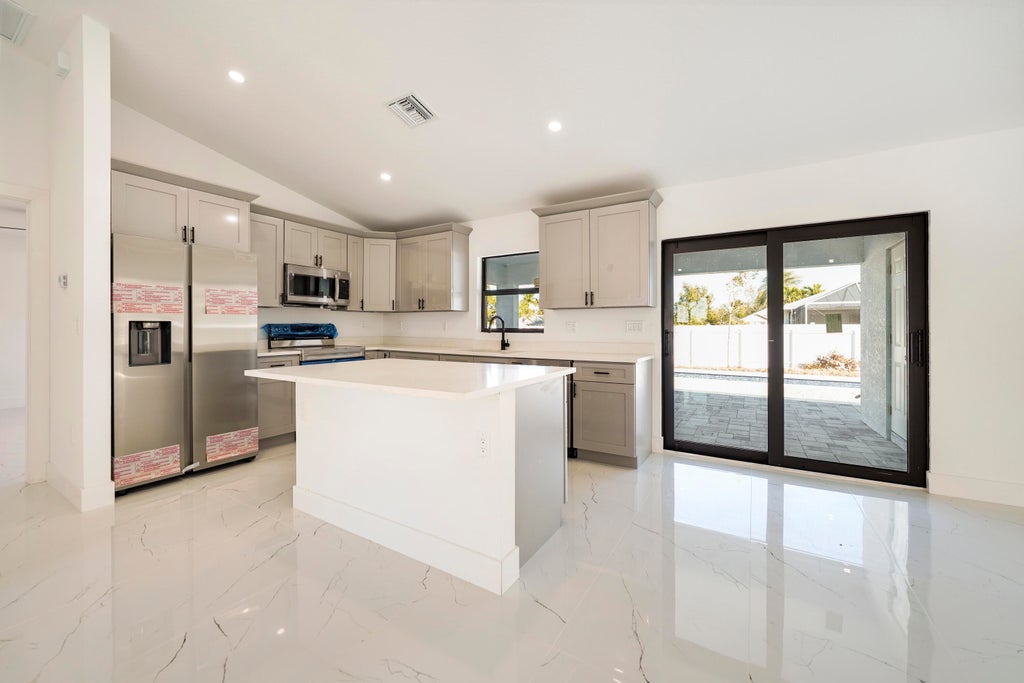 Photo of 1213 NW 22nd Place, Cape Coral, FL 33993 (MLS # R11149470)