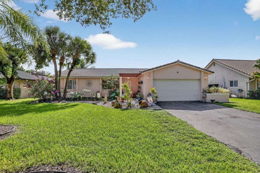 Brand NEW ROOF Being Installed! Bright & spacious 3BR/2BA/2CG single-family home in the heart of Coral Springs with NO HOA fees! This well-maintained home offers an open floor plan and a lushly landscaped private fenced yard with both screened & open patio areas —perfect for relaxing or entertaining. Neutral paint and freshly cleaned & stained tile floors.  The updated kitchen features granite countertops and stainless-steel appliances (all less than 5 years old). Bathrooms have been tastefully remodeled, and the home includes updated electrical, 2020 A/C, 2020 water heater, 2025 duct cleaning, and an impact-rated garage door. Enjoy the extra-long driveway, plenty of natural light, and a well for the sprinkler system. Centrally located near top-rated schools, parks, dining, and shopping.