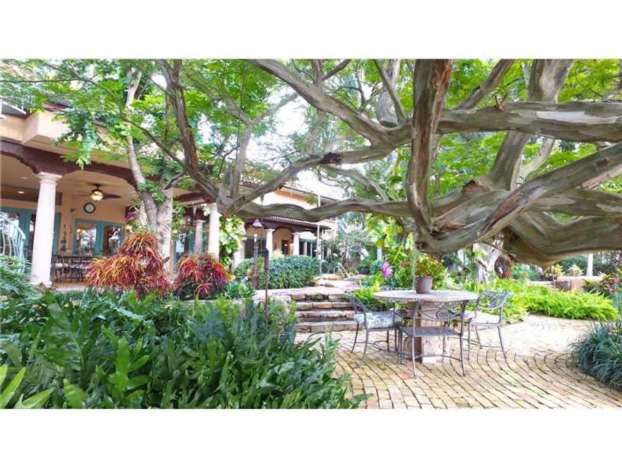 Sweeping views of the both the Intracoastal and mouth of the Middle River.  Mediterranean in style, richly landscaped lot with walkways leading to private sitting areas, terraces and covered porches all surrounding a tropical, heated lagoon.  Upstairs mas ter suite with library, separated from the rest of the home by an open span walkway overlooking the living room.  Formal dining area, living room with fireplace, family room, gourmet, eat-in kitchen. Please view the virtual tour to begin to understand.