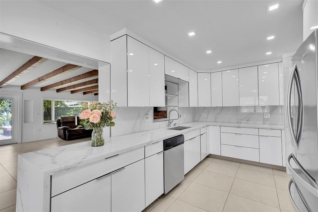 Photo of 301 NW 38th Street, Deerfield Beach, FL 33064 (MLS # F10514213)