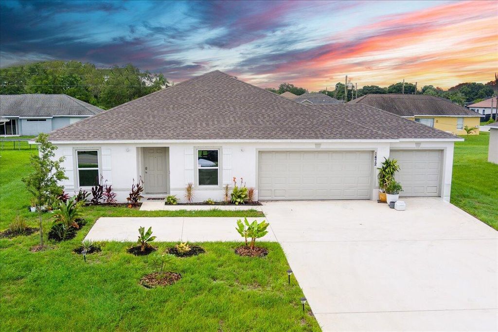 Photo of 1472 SW California Boulevard, Port Saint Lucie, FL 34953 (MLS # R10998072)