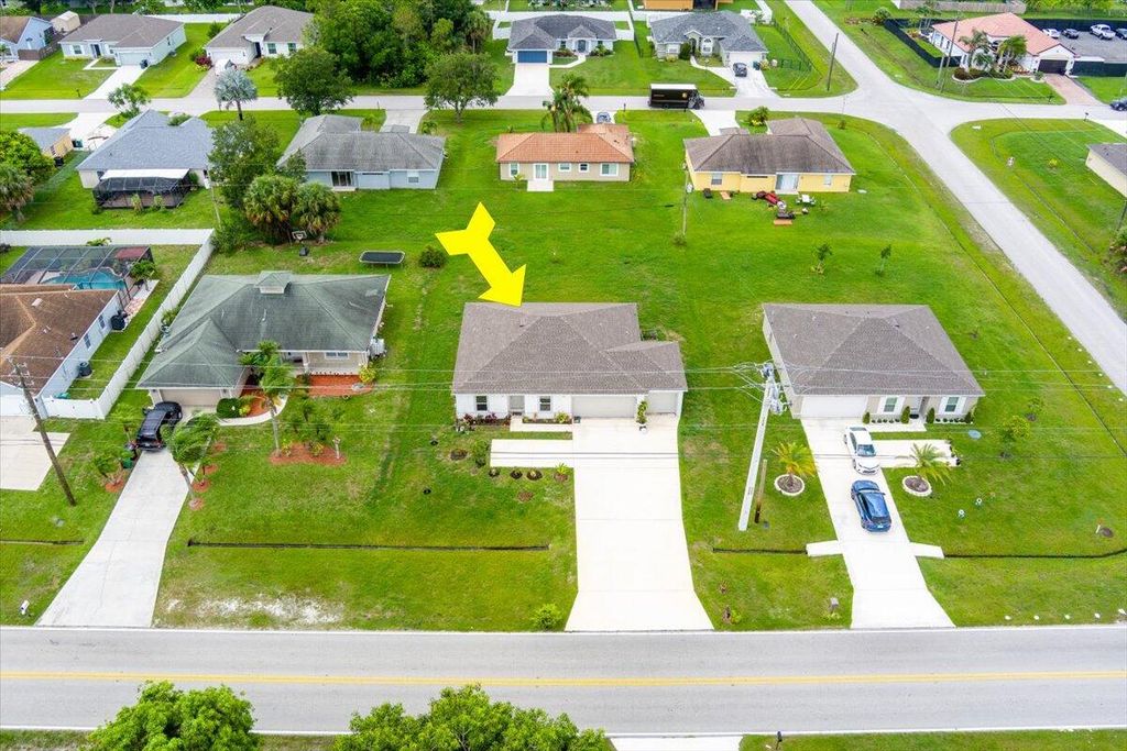 Photo of 1472 SW California Boulevard, Port Saint Lucie, FL 34953 (MLS # R10998072)