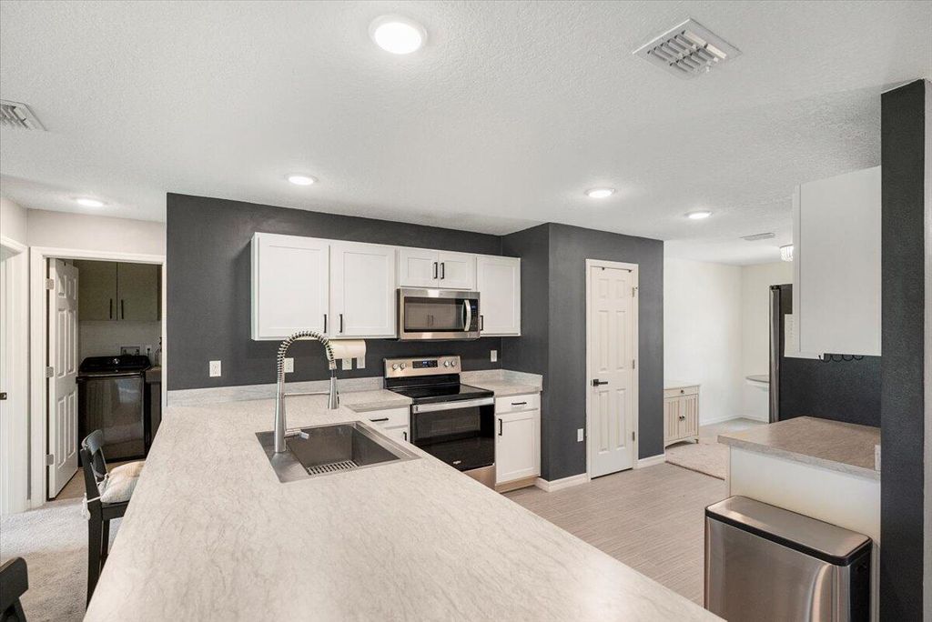 Photo of 1472 SW California Boulevard, Port Saint Lucie, FL 34953 (MLS # R10998072)