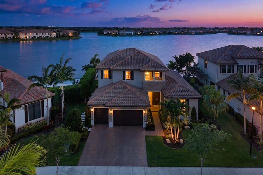 CC Homes Nouvelle model an expansive 5-bedroom 4.5 bath estate home with  private pool, 3-car garage, ideally set on a secluded cul-de-sac with a generously sized fenced waterfront homesite and approximately 4,700 SqFt of refined living space. The chef-inspired kitchen is appointed with dramatic waterfall quartz, gas cooking, a statement island, and contemporary cabinetry. Architectural designer custom details  throughout make this home a head turner. The first-floor owner's suite delivers a custom outfitted walk-in closet, dual vanities, spa-style walk-in shower, Roman soaking tub, and dual rain heads. An outdoor oasis with custom pool, screened lanai, summer kitchen, expansive pool deck, and tranquil water views. 24/7 manned security, and resort style amenities await your presence!