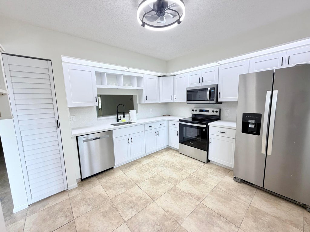 Photo of 1110 SW 125th Avenue #208M, Pembroke Pines, FL 33027 (MLS # B26088120)