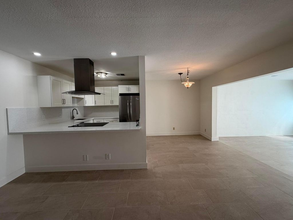 Photo of 5800 Fernley Drive W #3, West Palm Beach, FL 33415 (MLS # B26016490)