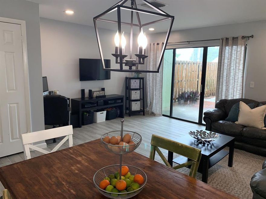 This updated, gorgeous town home is move in ready! The neutral interior features a soft monochromatic palette ready for any style of decor. Enjoy beautiful, wood-like tile, cool tones on freshly painted walls, clean & improved baths, custom lighting, & a modernized kitchen with lovely granite countertops, warm, wood cabinetry, & stainless steel appliances. The spacious, light & bright living areas look out onto the expansive, fenced, brick paved patio. Just add a pergola, maybe a fire pit, & you are ready for outdoor living. Continuing on upstairs, you will be greeted with two master suites, both with large baths. The rooms are truly oversized & provide the luxury of home office space or a sitting areas in each! New, energy efficient AC just installed. Call us for a showing today!