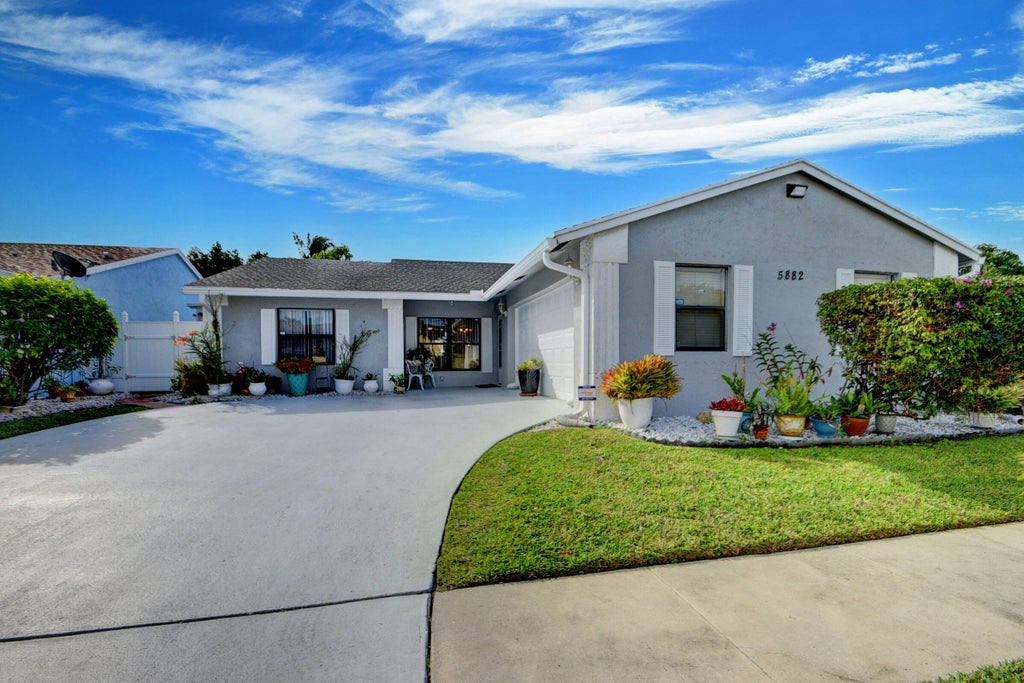 Photo of 5882 Lincoln Circle W, Lake Worth, FL 33463 (MLS # R11136104)