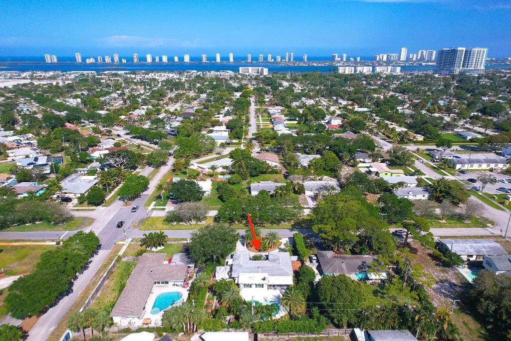 Photo of 830 Seminole Boulevard, Lake Park, FL 33403 (MLS # R11077616)