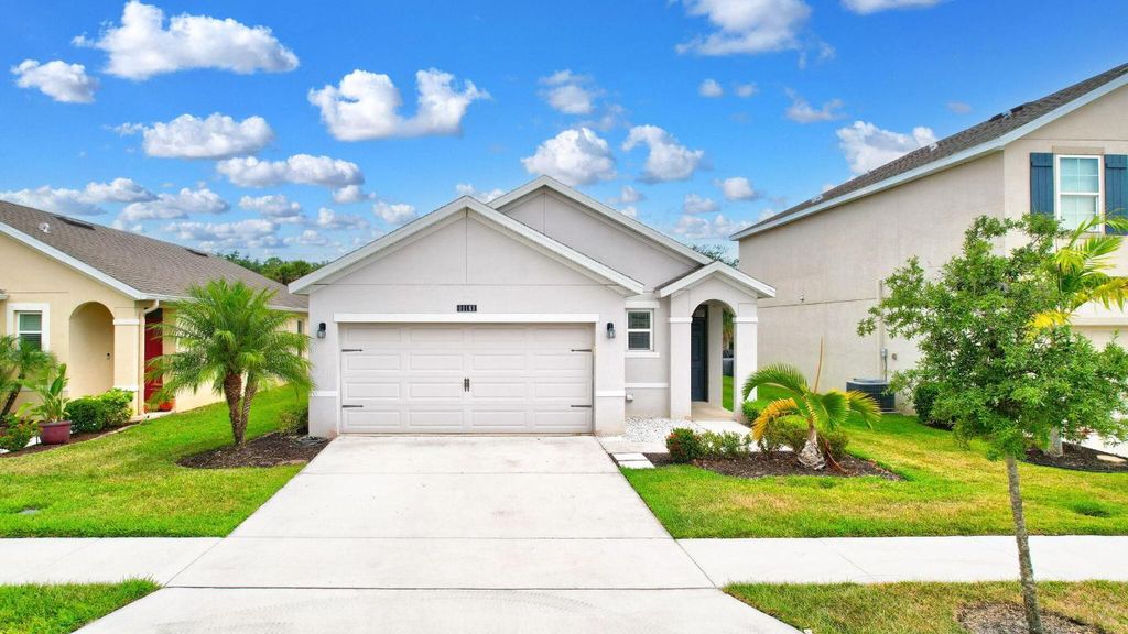 Photo of 11181 SW Sophronia Street, Port Saint Lucie, FL 34987 (MLS # R10993806)