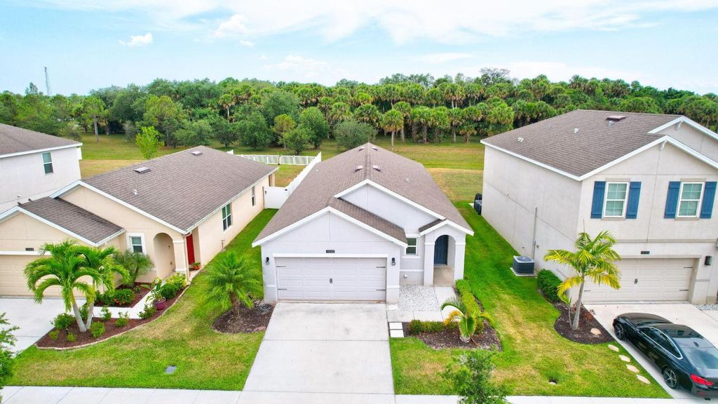 Photo of 11181 SW Sophronia Street, Port Saint Lucie, FL 34987 (MLS # R10993806)