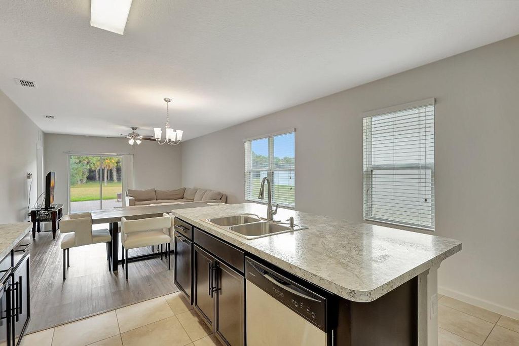 Photo of 11181 SW Sophronia Street, Port Saint Lucie, FL 34987 (MLS # R10993806)