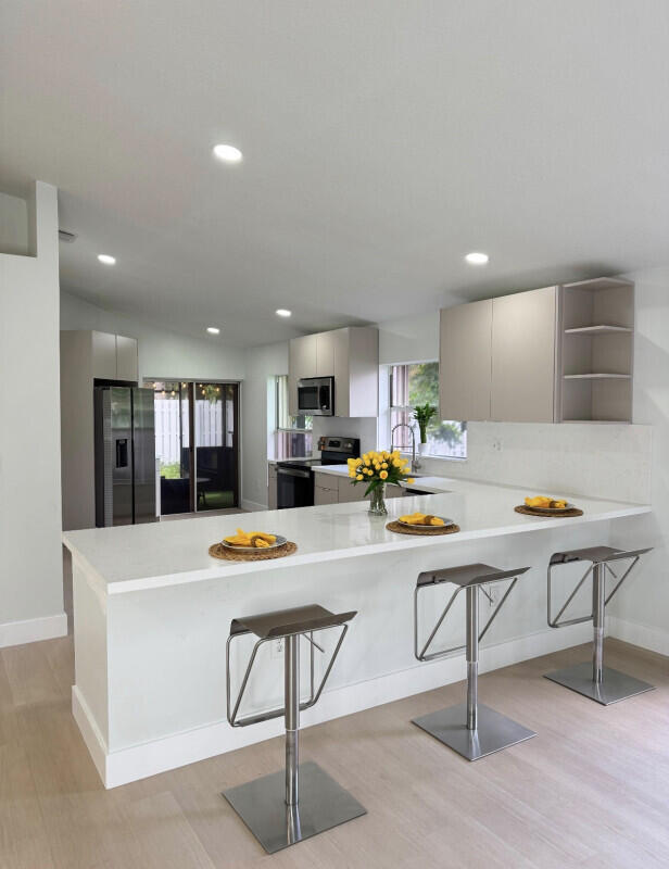 Photo of 1306 NW 125th Terrace, Sunrise, FL 33323 (MLS # B26075933)