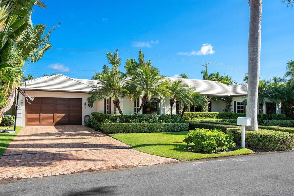 Fabulous north end 4BD/4BA 1 story home on an exclusive royal palm tree line street, featuring beautifully decorated bedrooms, limestone, hardwood floors, chef's kitchen, a 400 bottle wine cellar, hurricane impact windows & doors and a 2 car garage. Close access to the lake trail. The ultimate turnkey waiting for you!