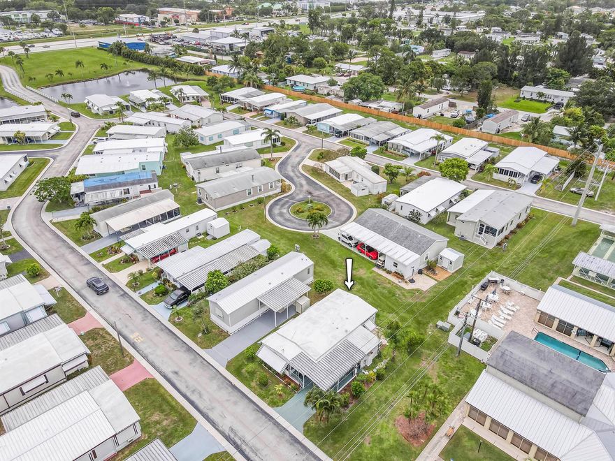 Welcome to this charming, partially furnished 2-bedroom, 2-bath home in the vibrant 55+ community of Natalie Estates!  This is a Co-Op community, No land lease! Needs a little TLC but is livable.  A great opportunity to add your personal touch and create your dream home or winter get-away.   Located next to Clubhouse and Pool all the amenities are just steps away.  Natalie Estates is centrally located close to downtown Stuart, shopping, restaurants and beaches.  Monthly fee of $220 includes basic cable, water, sewer, trash, recycling, and maintenance of common property such as clubhouse, pool, exercise room, card room and shuffleboard.  There is a storage lot for your Boat or RV available on site.