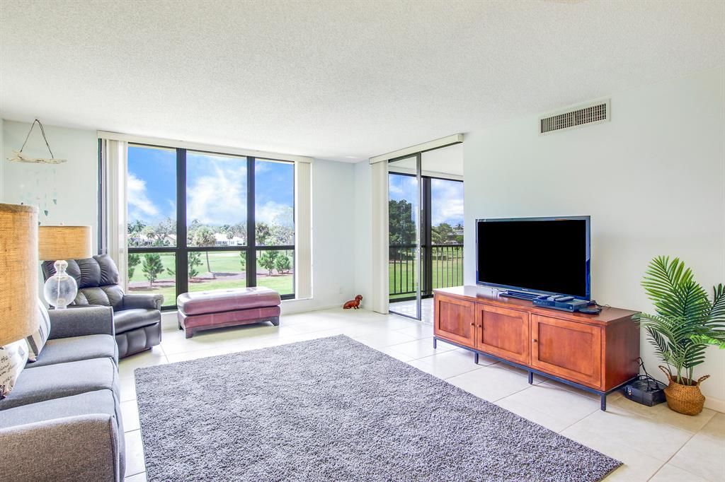 Photo of 5350 Woodland Lakes Drive Dr #310, Palm Beach Gardens, FL 33418 (MLS # R10834142)