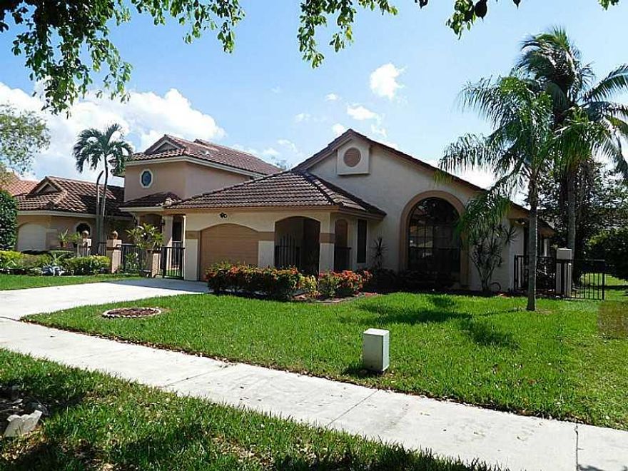 Exactly what your looking for! Spacious, bright open floorplan. Updated home with Beautiful glazed french vanilla wood cabinets and granite counter tops. Separate spaces for living and family rooms, laundry closet in house, Neutral big tile floors, new wo od in Bedrooms. Spacious screened patio for entertaining. Driveway holds 4+ cars, plus garage. A/C 4 years new. Neighborhood attends great schools, close to highways, shopping, beach nestled right between Boca and Ft Lauderdale.