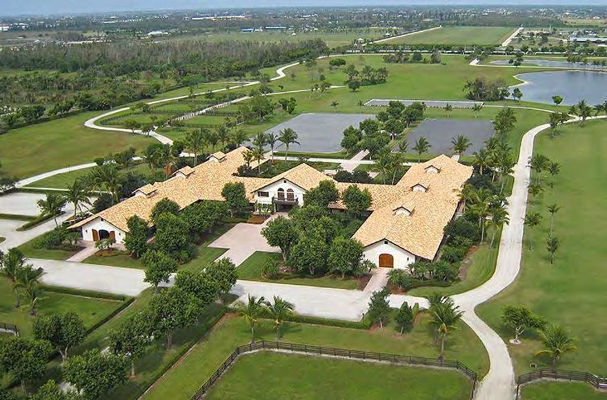 Windsome Farms is Wellington's most premier trophy equestrian facility, prominently located on South Shore Blvd., in the center of Wellington's prestigious Equestrian Preserve. Its improvements are second to none including a meticulously maintained 52 European style stall stable, residences and extensive tackrooms and owner's lounge. Situated on 80 acres of manicured grounds that include 3 training rings, a grand prix course and miles of improved trails with maintenance and storage facilities. Please view Property Brochure in attached docs.