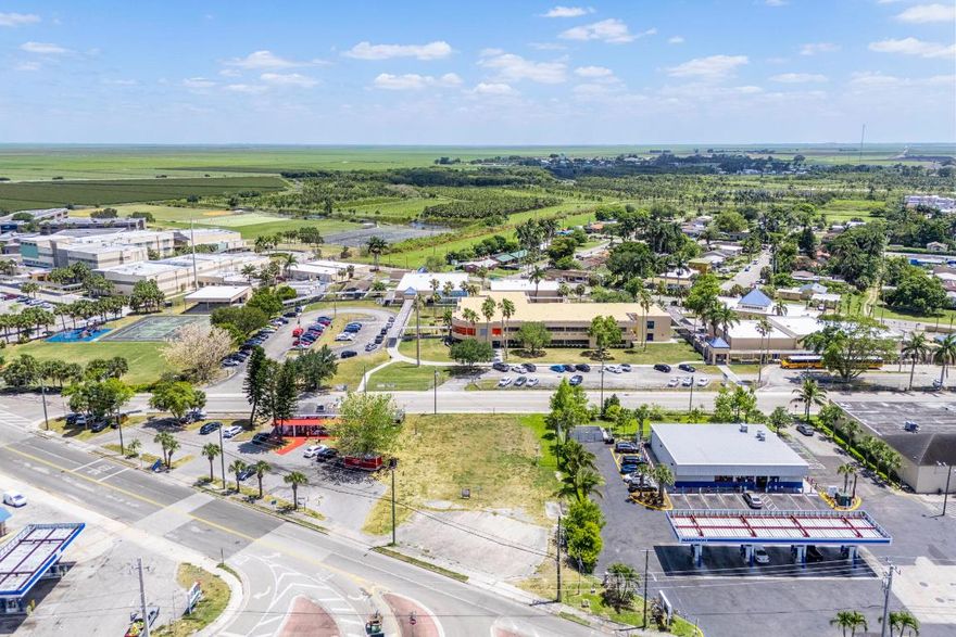 Prime 0.45-Acre Property in the Heart of Downtown Pahokee - Endless Commercial Possibilities. Located in the heart of downtown Pahokee, this 0.45-acre vacant lot offers unmatched potential for a wide range of commercial developments. Its strategic location near shopping centers, gas stations, and key businesses ensures high visibility and accessibility, making it an ideal site for entrepreneurs and investors. Zoned for commercial core, residential, office, and entertainment uses, the property provides flexibility for various ventures including retail spaces, office buildings, mixed-use developments, or entertainment venues. Whether you're looking to create a bustling business hub or a vibrant community center, this property offers endless possibilities for growth and success.
