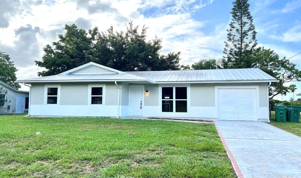 Photo of 709 SW Nichols Terrace Ter, Port Saint Lucie, FL 34953 (MLS # R10814686)