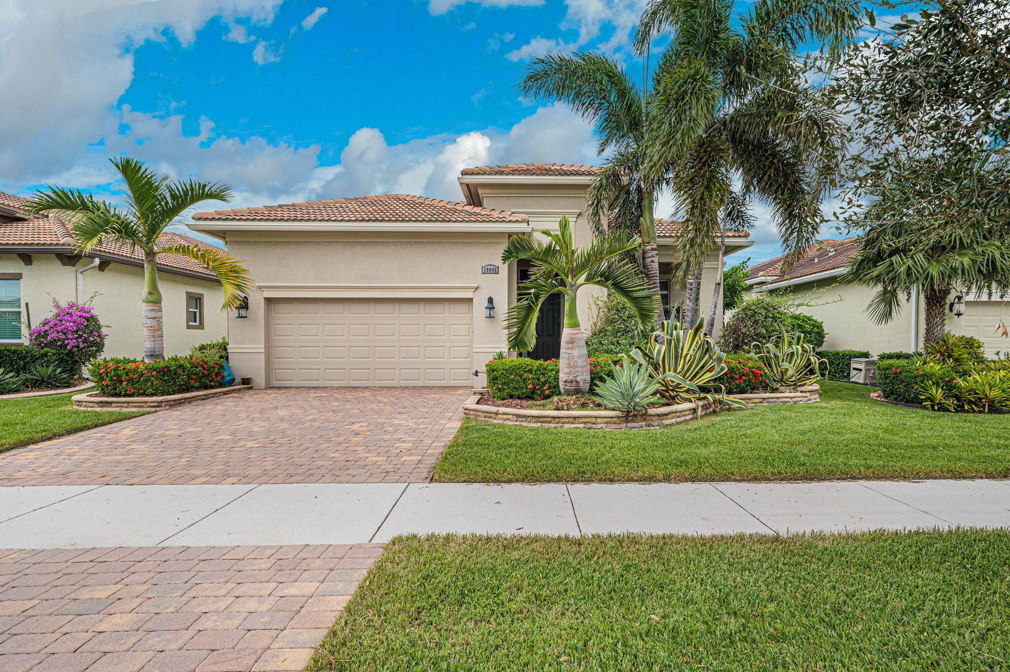 Sit back, relax, put your feet up and enjoy the sunset every evening overlooking your gorgeous pool and the sparkling lake view in PGA Verano, one of the most sought after and amenity rich communities, on the Treasure Coast. From the soaring ceilings with crown molding to the elegant fire bowls by the pool, not one detail has been overlooked. This move in ready and well appointed home features a pool with a hot tub and a sun shelf, a welcoming front porch, impact windows, gorgeous island kitchen and more. This open concept home was lovingly thought out & designed to entertain your friends and family for years to come. 2 easily possible 3 bedrooms. Fresh paint in living areas. Bonus: solar panels will be paid off at closing, so your will have minimal electric bills!