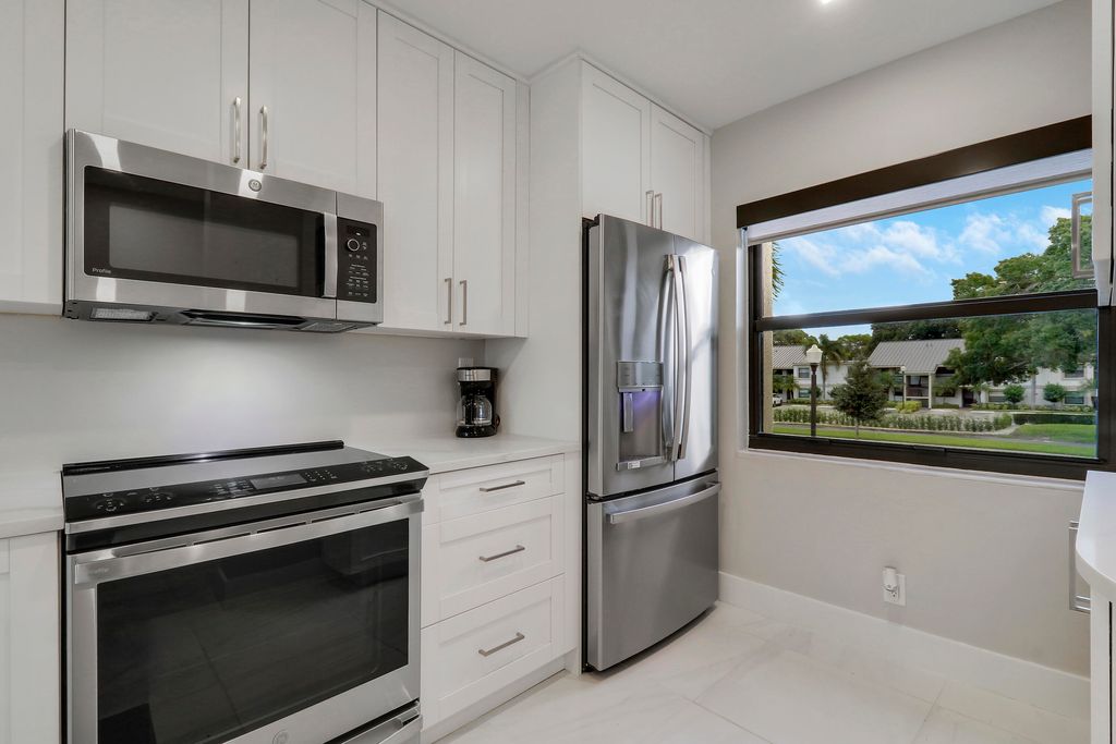 Photo of 12911 Briarlake Dr #202, Palm Beach Gardens, FL 33418 (MLS # B26000636)