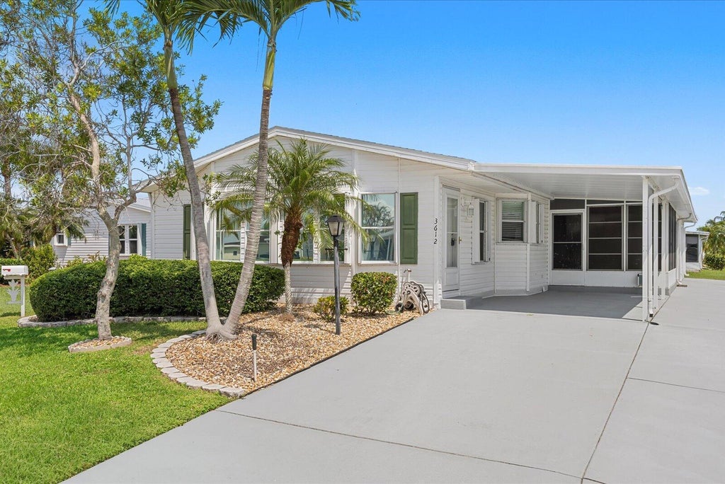 Photo of 3612 Pebble Beach Lane, Port Saint Lucie, FL 34952 (MLS # B26064547)