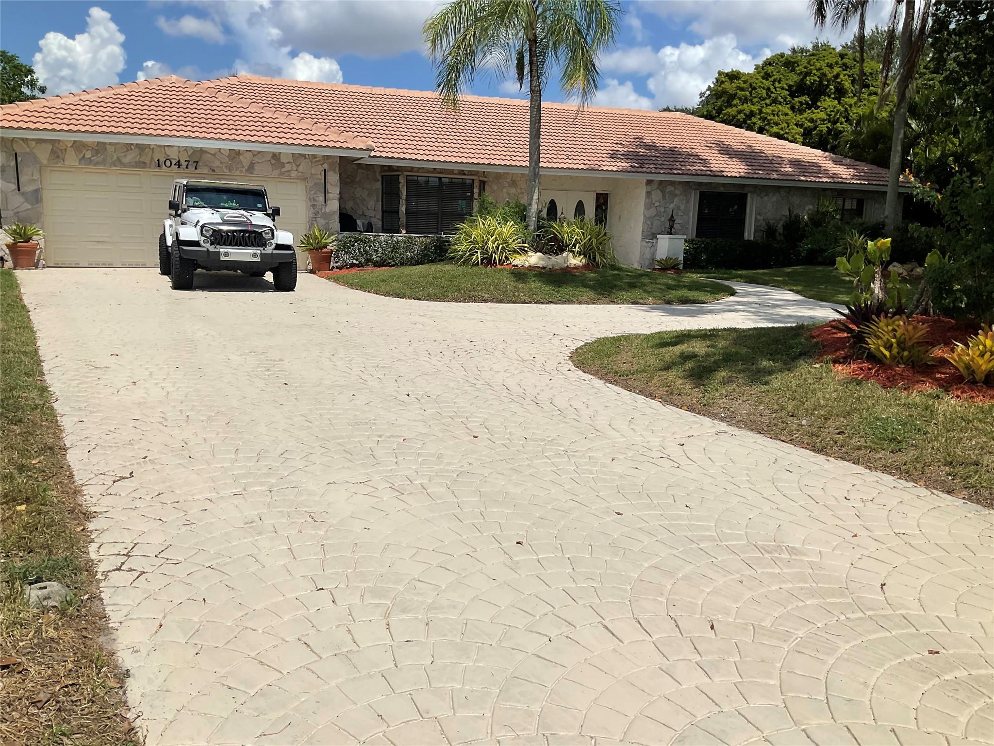 Exquisite 4 bedroom, 3.5 bathroom estate with sweeping driveway, sprawling lot & lush landscaping on peaceful cul-de-sac in the desirable neighborhood of 'The Oaks'. NO HOA.
This beautifully renovated home features two spacious master suites, huge walk in closets, a cedar closet, 2025 roof, newer a/c's, new tile & a gourmet kitchen with custom cabinetry, stainless appliances & waterfall granite countertops.
The resort-style backyard boasts an oversized diving pool, fountain, gazebo, large garden with deck & gorgeous sunset views. The outside bar and grill area features an open large seating area to enjoy the lovely Florida evenings.
The bathrooms are newly tiled, the master bath has a corner jacuzzi tub for a spa-like soak.
Separate laundry room offers cabinetry and new washer dryer.