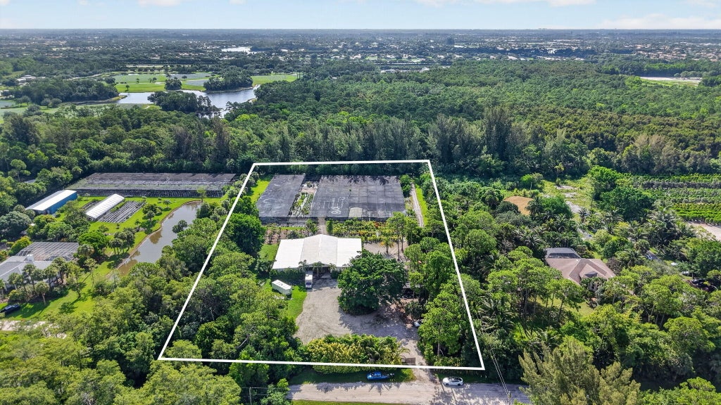 Photo of 6700 Park Lane E, Lake Worth, FL 33449 (MLS # B26051172)