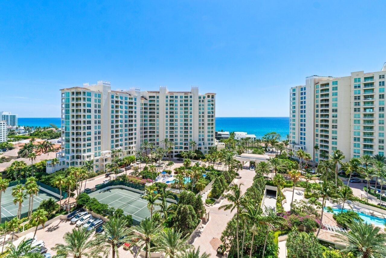 OCEAN, INTRACOASTAL, CITY & THE GRAND PIAZZA BELOW WITH AMAZING VIEWS IN EVERY DIRECTION! 5 ACRES OF LUSHLY MANICURED LANDSCAPING, SPARLING FOUNTAINS, 3 HEATED POOLS, SPA HOT TUBS, TENNIS COURTS, BRICK PAVED WALKWAYS & BLOSSOMED TRELLISES THAT ILLUMINATE AT NIGHT WITH RESORT STYLE LIGHTING! THIS SUN FILLED APARTMENT FEATURES 9 FT CEILINGS, A SPLIT BEDROOM PLAN, FLOOR TO CEILING IMPACT SLIDERS, TWO PRIVATE BALCONIES, AN EN SUITE GUEST BEDROOM, MARBLE FLOORS, WALK IN CLOSETS, CUSTOM DRAPES, SOFFITED LIGHTING & IMMACULATE MOVE IN CONDITION! TOSCANA OFFERS A PRIVATE BEACH CLUB ON THE SAND, BBQ AREA, VALET SERVICES, 24 HOUR MANNED GATE & CONCIERGE, CARD ROOMS, FITNESS, BILLARDS, SOCIAL ACTIVITIES & PARTIES! LOCATED IN PRESTIGIOUS HIGHLAND BEACH BETWEEN THE OCEAN THE INTRACOASTAL WATERWAYS!