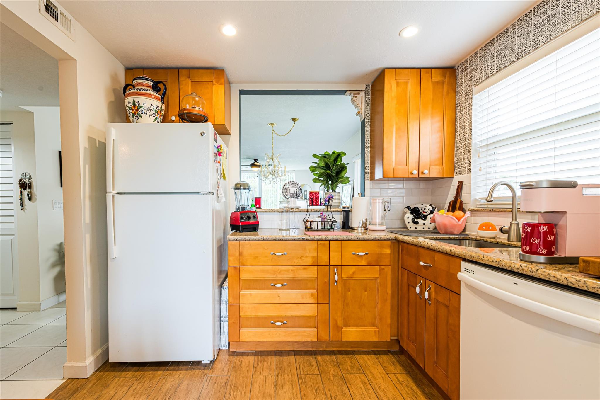 This "super clean" - MOVE-IN Ready 2 bedroom / 2 bath condo is a CORNER UNIT with larger kitchen space and separate eating area - perfect for morning breakfast or afternoon lunch. As you step inside, the bright, airy ambiance of this unit welcomes you, with natural light streaming through large windows overlooking water and sunset views, balancing openness and privacy. Updated modern Kitchen & bathrooms, Impact windows, Storm Shutters, Walk-in Closet, Tile & Wood-Like Flooring. Nestled in an active 55+ community, this unit is more than a place to live—it's a place to thrive. Community Amenities includes heated pools, new PickleBall Courts, BBQ/Picnic areas, Clubhouse with monthly Bingo and other actives. Minutes to restaurants, shopping, casino, worship centers, medical services and more.