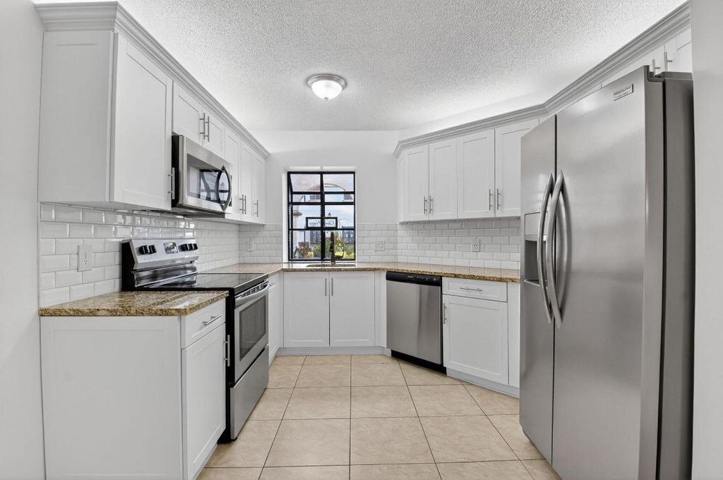 Photo of 5140 Floria Way #F, Boynton Beach, FL 33437 (MLS # R11141879)