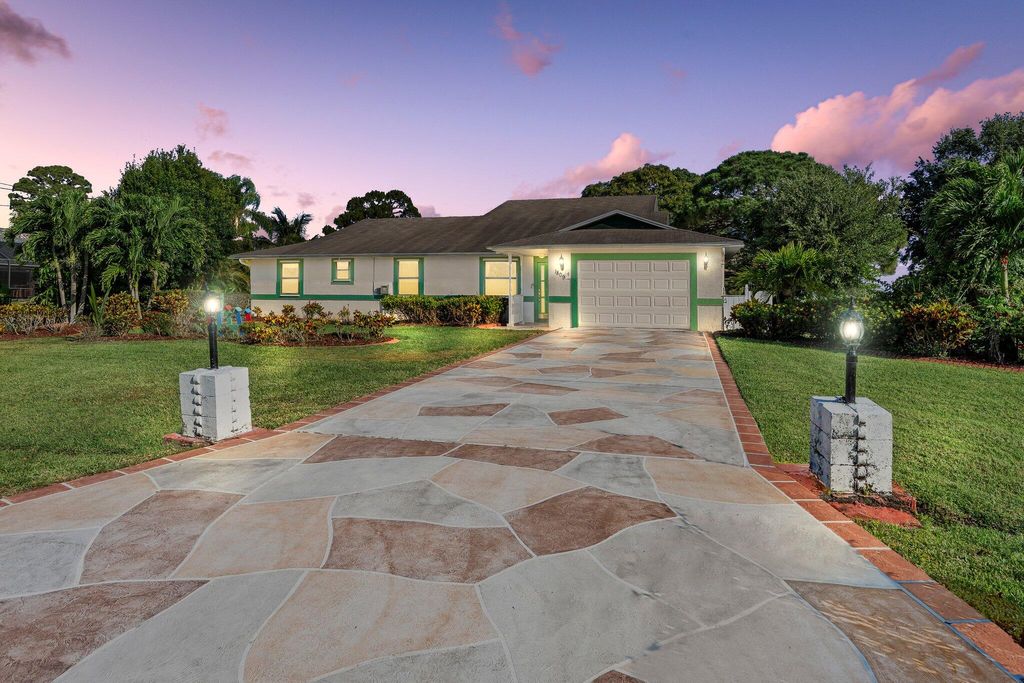 Photo of 1809 SE Deming Avenue, Port Saint Lucie, FL 34952 (MLS # R11091312)