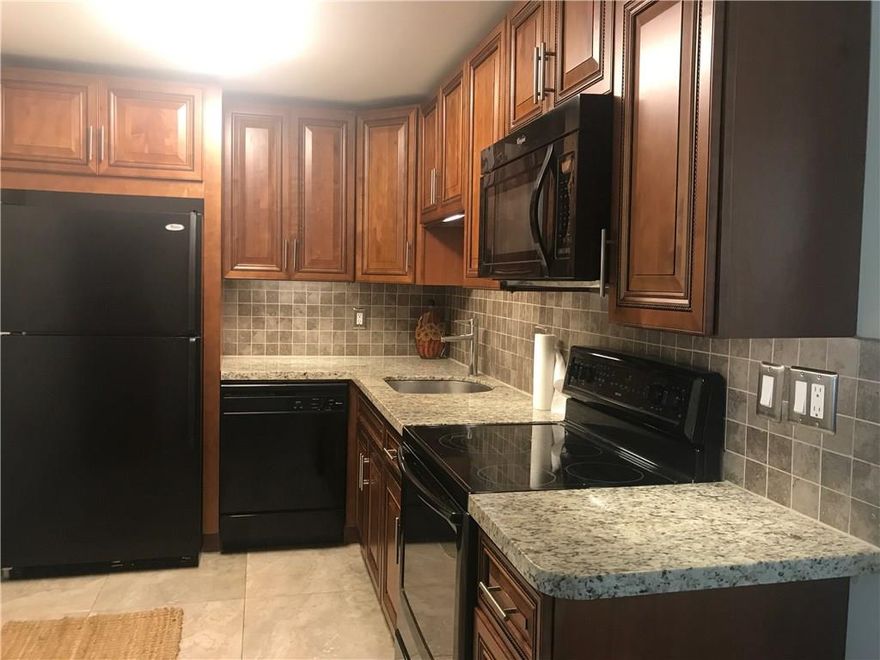 Beautiful 2nd floor CORNER unit with open floor plan and completely renovated. Granite counters with new cabinetry.  Tile through out the living area, new carpet in the bedroom, washer and dryer in unit.  This charming unit is in biking distance to the beach and surrounded by many anchored plazas, restaurants and cafes.