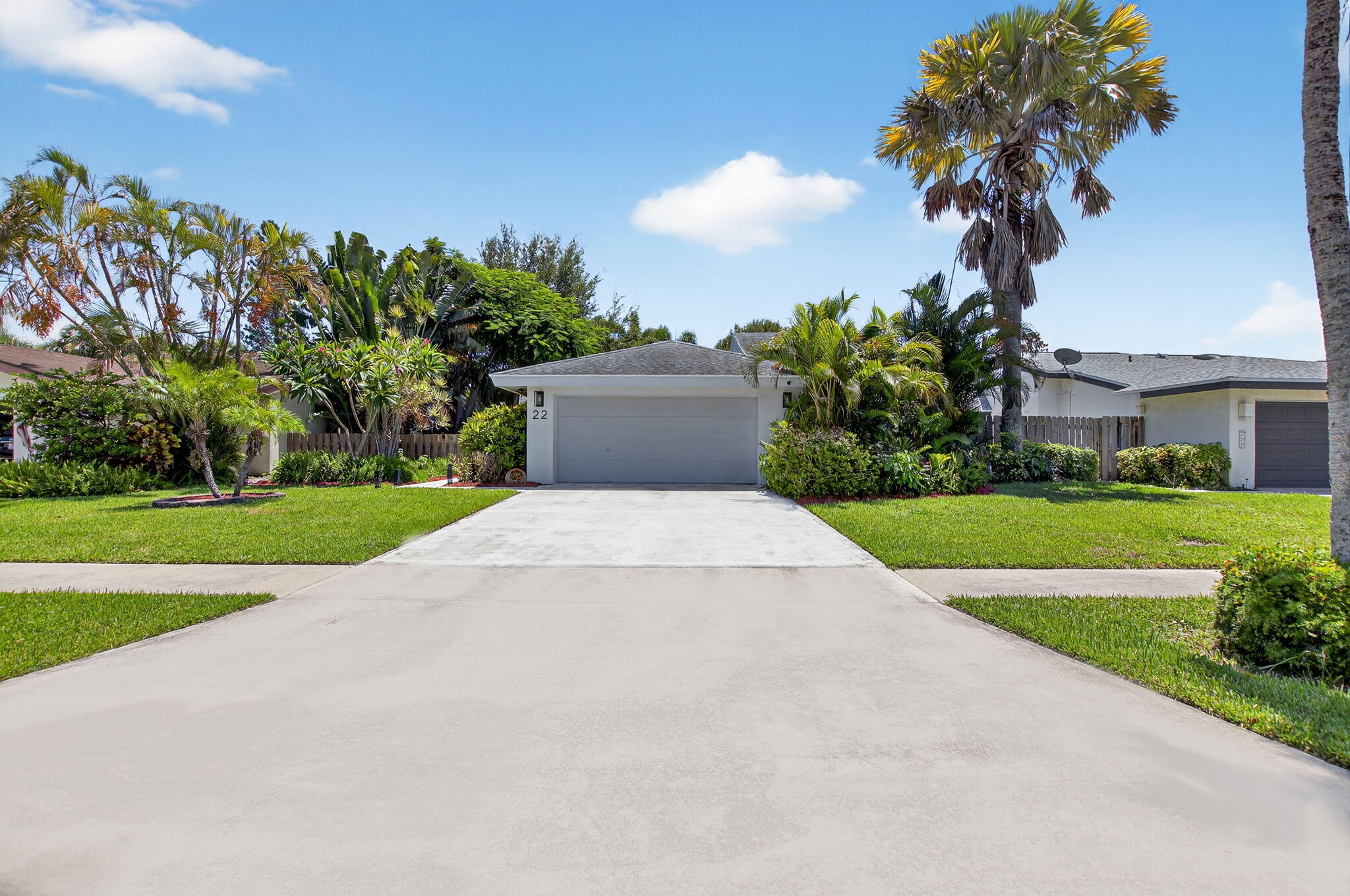 Welcome to this beautifully maintained home in the all ages community of Baytree at the Meadows. This home features 2 large bedrooms, 2 full bathrooms, and a 2-car garage. Step inside to discover a bright and open layout with vaulted ceilings and plenty of natural light. The kitchen boasts updated stainless steel appliances and ample counter space, perfect for cooking and entertaining.The main bedroom offers a peaceful retreat with a walk-in closet, ensuite bathroom, and sliding glass doors that open to the serene backyard. The guest bathroom has been beautifully renovated Step outside to your own private oasis--complete with a large screened-in patio, a firepit, new sod (2025), and a tranquil canal view. This is the perfect backyard for relaxing or entertaining.