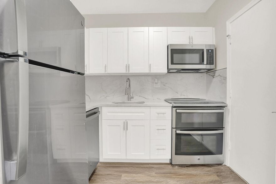 Unfurnished and move-in ready, this beautifully renovated 2BR/2BA condo is now available. Just bring your  toothbrush!   Updated kitchen and bathrooms.  Neutral flooring throughout. Prime  location  - close to  Mizner Park and ocean beaches.  Walkable to nearby Publix, Fresh Market, Trader Joe's, Walgreens and places of worship. Includes one assigned parking space plus one guest parking. Washer and dryers located in building.  Available immediately for annual rental.  Make your appointment today!