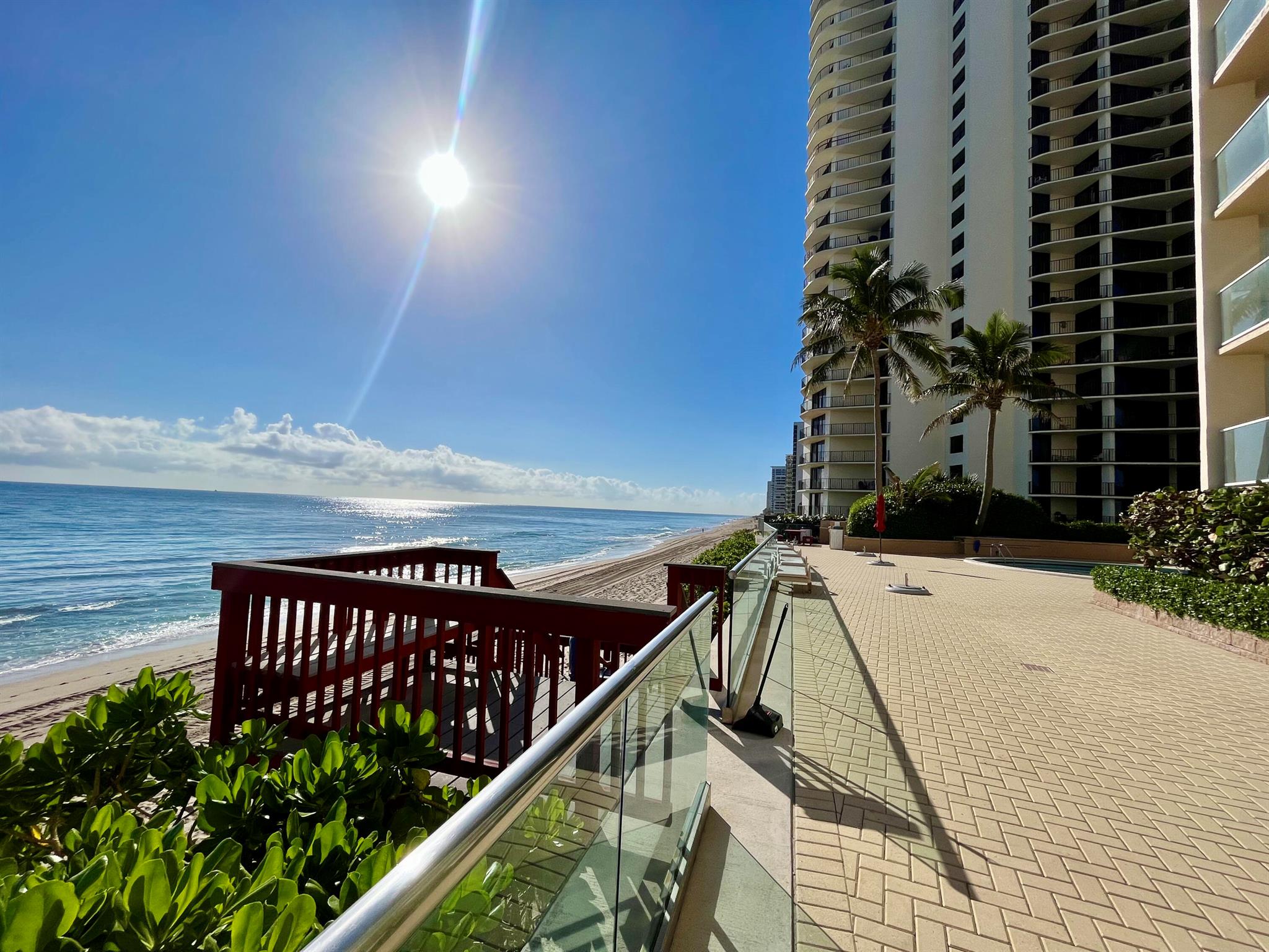 Pristine updated 2/2 Southwest Corner Unit available for annual rent. Unit is turnkey and has all the bells and whistles. Updated open kitchen concept overlooking the ICW and into the living/dining room. Impact glass sliding doors and windows throughout. Cozy but large bedrooms with King size bed in the master and Queen size pullout in the guest room. Crib if needed. TV's in all bedrooms. Builtin closets for easy storage of personal items. Renovated bathrooms featuring rain showers and jacuzzi tub. Stackable washer/dryer in unit. Covered parking space right by the front door. The bldg features a circular pool overlooking the oceans edge. Beautiful private beachfront access on Singer Islands private beaches. Bldg features a large fitness room, billiards, community room and kitchen...