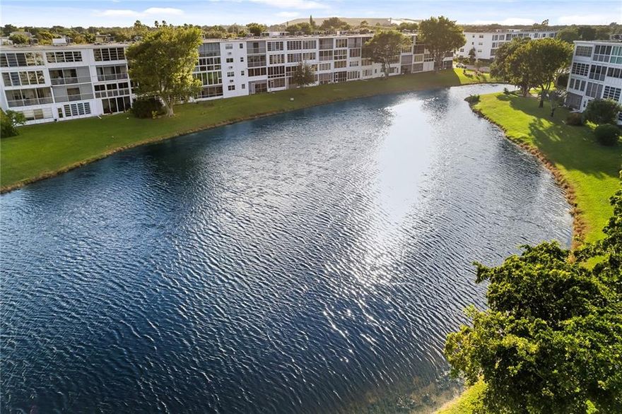 Enjoy the beautiful lake view from your oversized balcony. Sitting on the top floor this 1 bed 1 bath has brand new flooring in the living room and master bedroom. Brand new dishwasher, and recently purchased oven/range. 1 designated parking spot. This well maintained elevator building, is surrounded by water offering peaceful views and calming breezes.
Great location close the the pool. Century Village is an active 55+ community offering resort style living. 24/7 guard gated. Clubhouse, heated pools, bus service mini golf & plenty more. Minutes to the Beach and Restaurants.