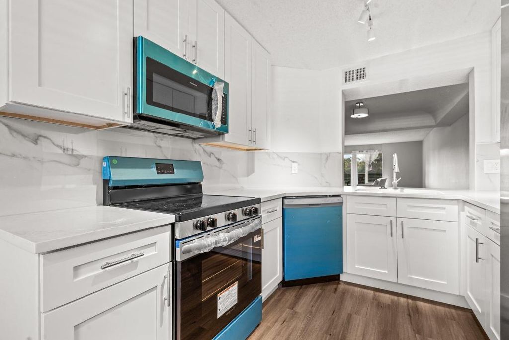 Photo of 23395 Carolwood Lane #207, Boca Raton, FL 33428 (MLS # R11139312)
