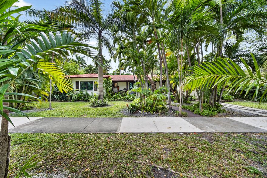 Set on an expansive 10,400-square-foot lot in one of Coral Gables' most coveted locations, this private 3-bedroom, 2.5-bath pool home presents a rare opportunity to reimagine, renovate, or build brand new. Surrounded by lush vegetation and mature greenery, the property offers a serene, gated backyard retreat—an exceptional sense of privacy rarely found so close to the city's most vibrant lifestyle destinations. Just steps from Miracle Mile, Merrick Park, and Gables Plaza, world-class dining, boutique shopping, and cultural experiences are effortlessly within reach.  Whether you choose to renovate the existing floorplan or create a custom residence from the ground up, the generous lot size and premier setting provide endless potential. Independently appraised at $1,669,715, this is a true Coral Gables opportunity not to be missed.